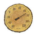Round tree trunk cross section thermometer with visible growth rings and Fahrenheit scale around the edge