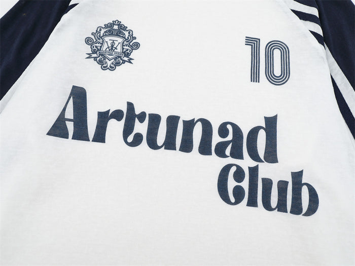 Close-up of the tee's navy chest graphic showing Arctunad Club text, crest emblem, and number 10