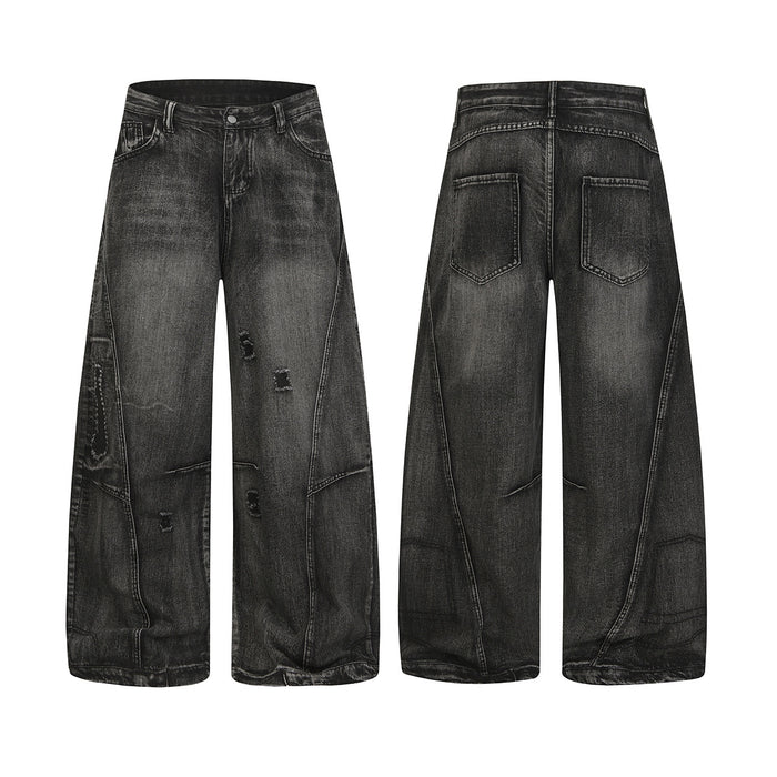 Black baggy ripped wide-leg jeans with acid-washed finish and curved panel seams, front and back view