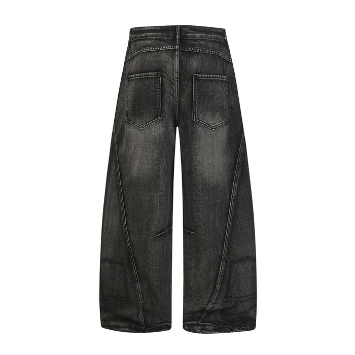 Full back view of black washed baggy jeans with two rear patch pockets and wide legs