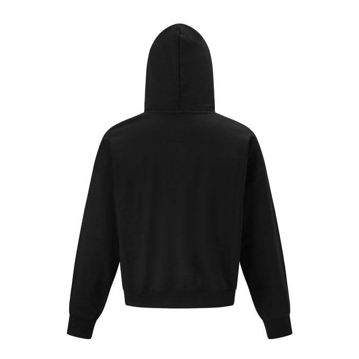 Back view of a black oversized hoodie showing its plain body, hood, long sleeves, and ribbed hem