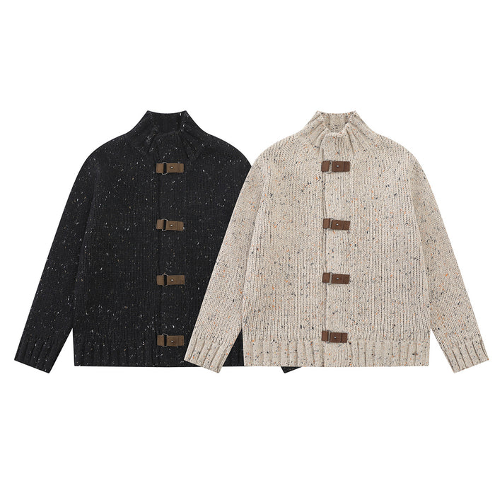 Two chunky knit mock-neck cardigans in black and speckled beige, shown from the front with leather buckle closures