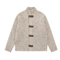 Chunky ribbed knit cardigan sweater with brown leather buckle closures and mock neck in oatmeal and black