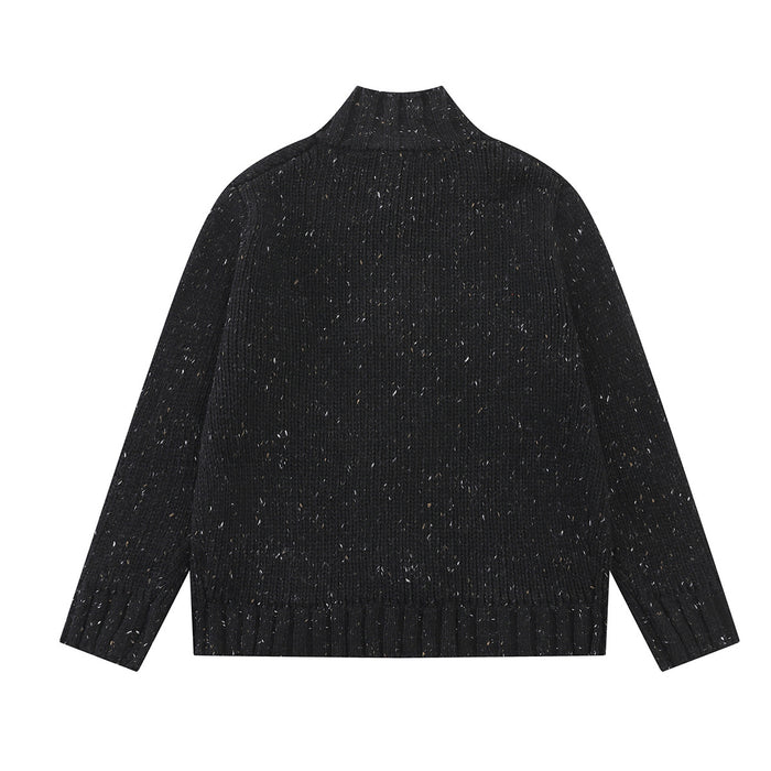 Black chunky knit cardigan shown from the back with a mock neck and ribbed hem and cuffs