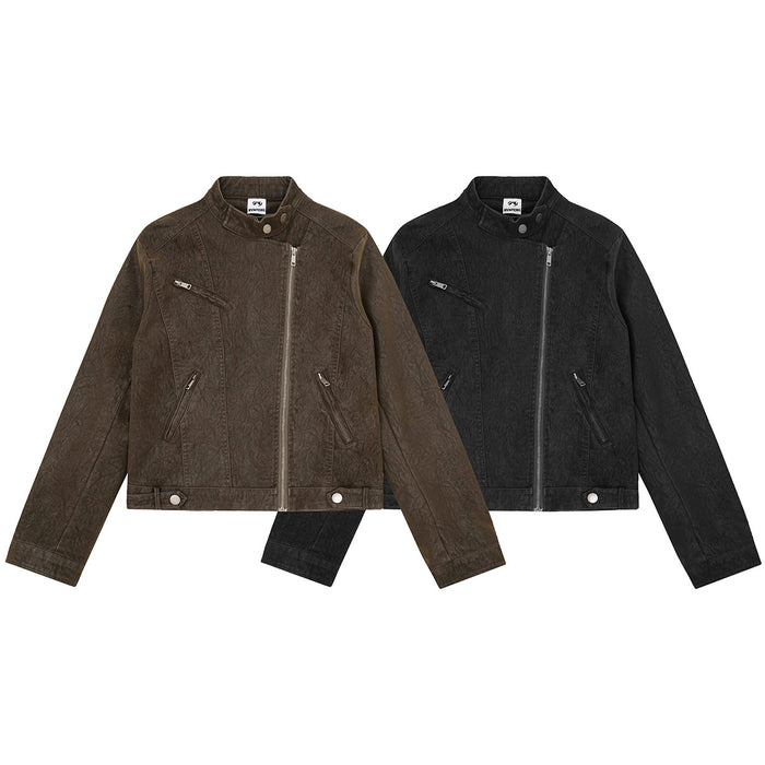 Front view of cropped moto jackets in distressed brown and black with asymmetric zippers and snap-tab hems