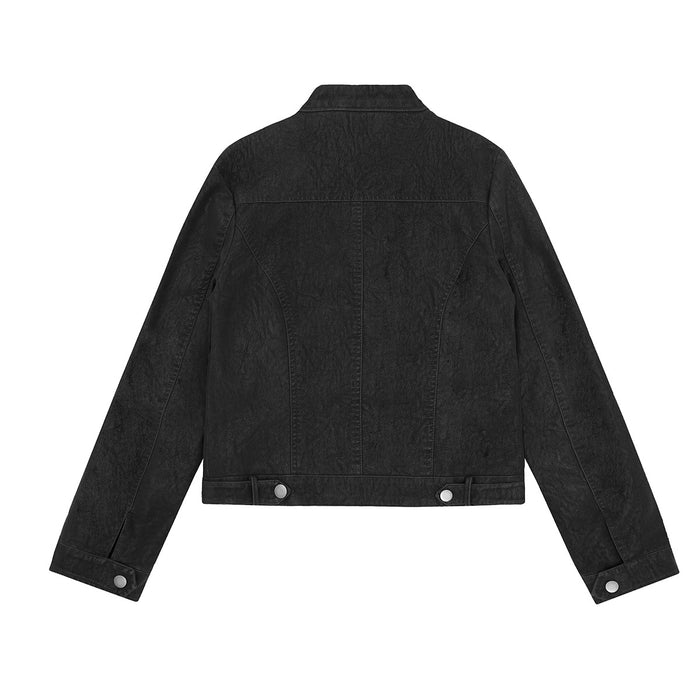 Back view of a distressed black cropped moto jacket with panel seams, stand collar, and snap-tab cuffs