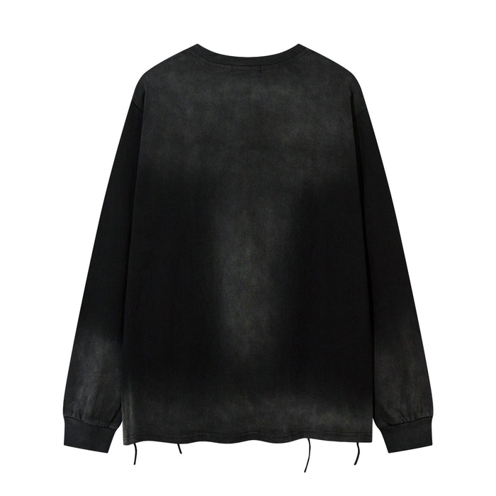Back view of a black acid-washed long sleeve shirt with subtle fading, distressed hem and loose hanging threads