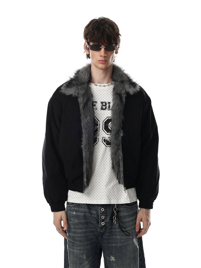 Oversized padded bomber jacket with grey faux fur collar shown in black, worn open over a graphic tee with distressed jeans