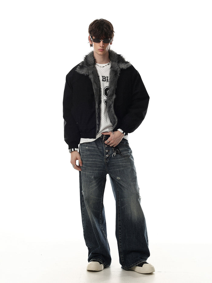 Full-length model view of a black oversized bomber jacket with gray faux fur collar and ribbed cuffs