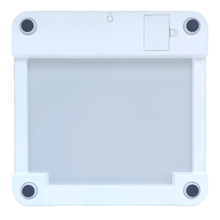 Bottom view of white glass digital bathroom scale showing four round feet and a battery compartment door.