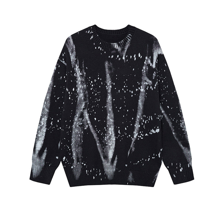 Oversized crew neck knit sweater with ink splash paint splatter pattern in black colorway, front view
