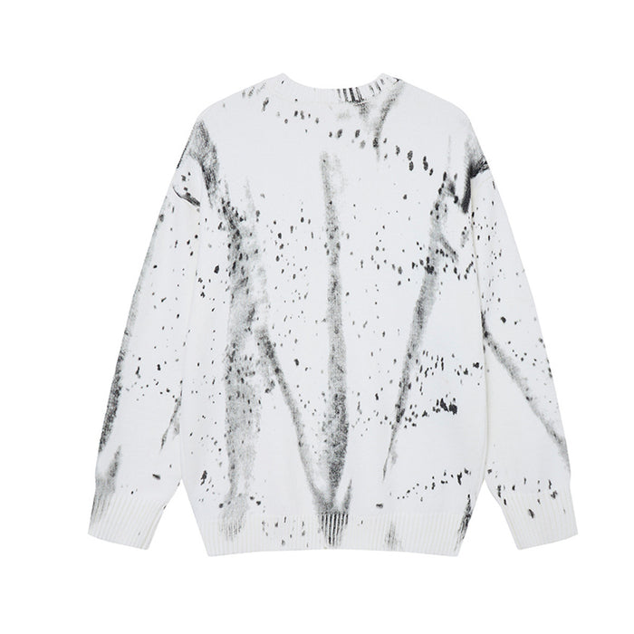 White knit sweater shown from the back with gray streaks and scattered black distressed marks