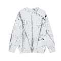 White knit sweater shown from the back with gray streaks and scattered black distressed marks