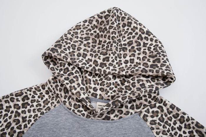 Close-up of the leopard-print hood and neckline on the gray raglan hoodie