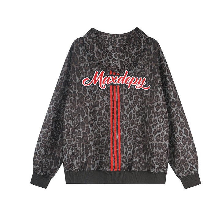 Back view of a charcoal gray leopard-print zip-up hoodie with white script lettering and red vertical stripes