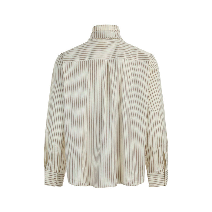 Back view of the cream striped dress shirt showing the yoke, vertical lines, long sleeves, and button cuffs
