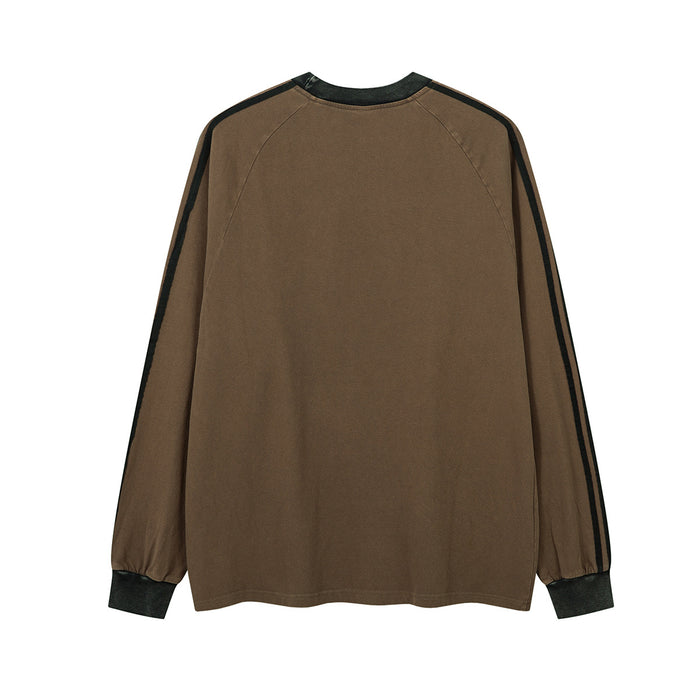 Back view of a brown long sleeve raglan shirt with black striped sleeves and dark cuffs