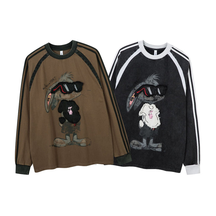 Brown and black raglan long sleeve shirts shown together with striped sleeves and rabbit graphics