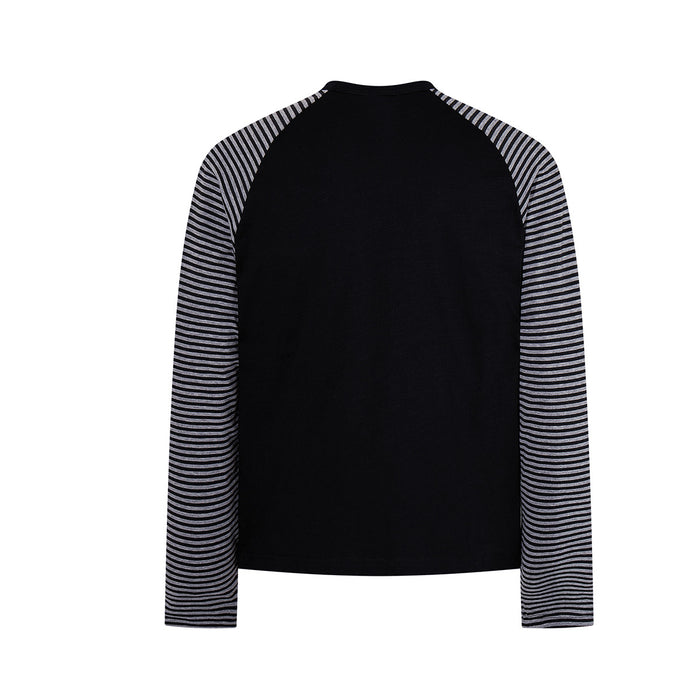 Back view of black raglan shirt with black-and-white striped sleeves and plain body