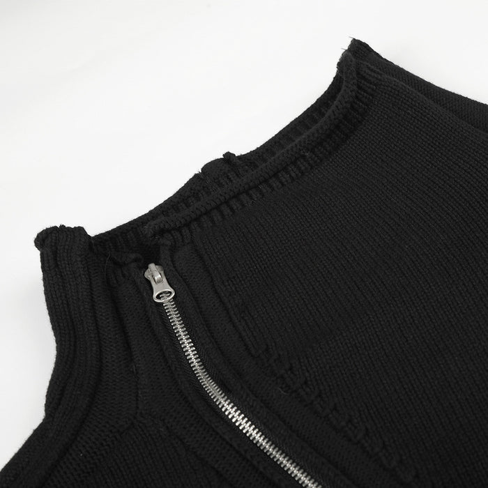 Close-up of the black knit jacket collar and silver diagonal zipper with ribbed trim