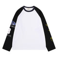 White raglan long sleeve tee with black sleeves, dark collar, and yellow graphic sleeve print