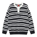 Front view of a black and white striped knit henley sweater with white button placket and dark script chest detail