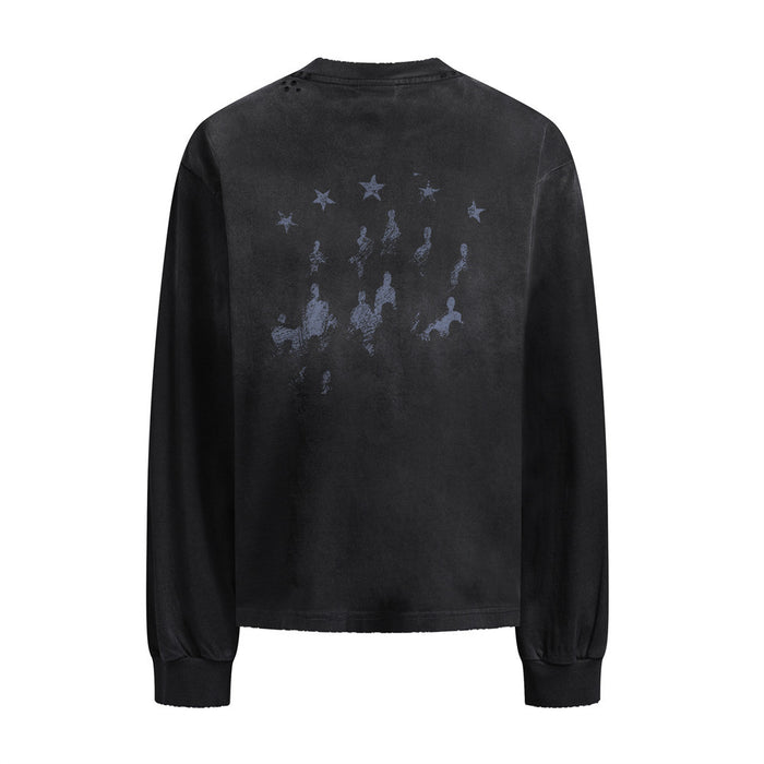 Black long-sleeve shirt back with a faded graphic of stars and seated figures