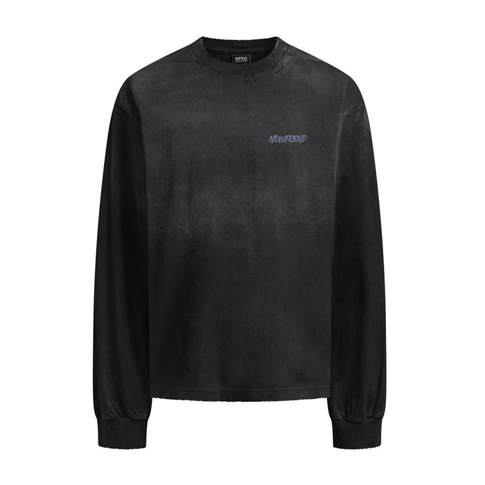 Black faded-wash long-sleeve shirt front with a small graphic mark on the chest