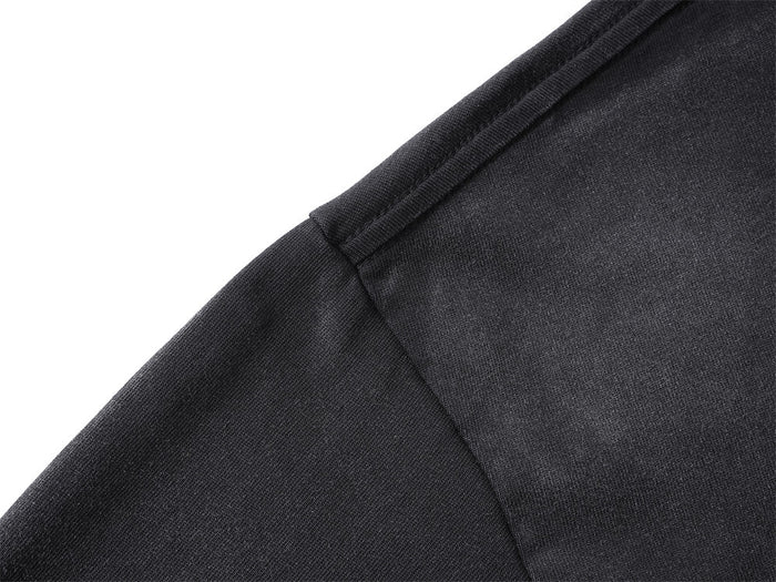 Close-up of the black shirt shoulder seam and fine fabric texture