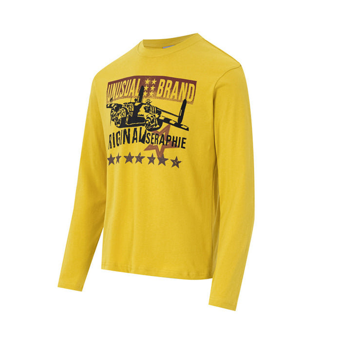 Angled view of a yellow long-sleeve shirt featuring a fighter jet graphic and star print