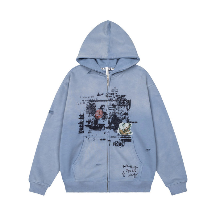 Washed light blue zip-up hoodie with hood, distressed details, and black collage graphic on the front