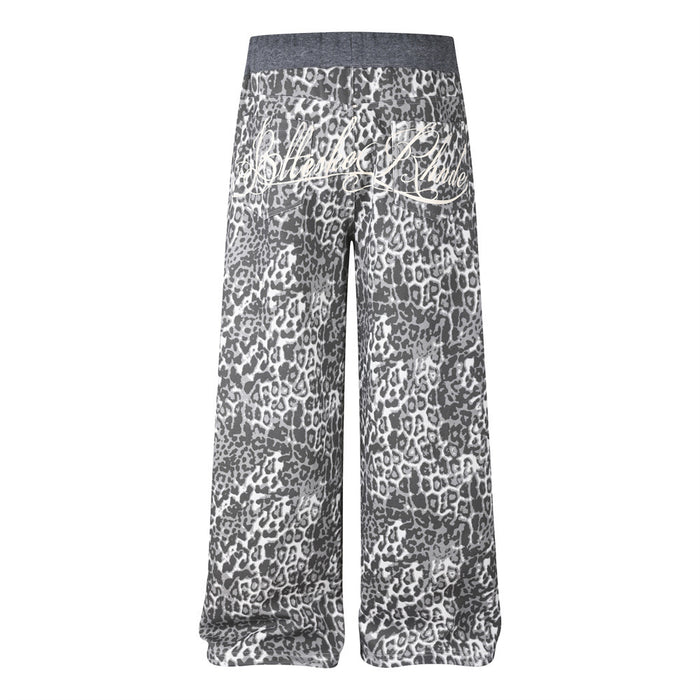 Back view of grey leopard-print wide-leg sweatpants with large white cursive embroidery