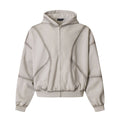 Oversized men's full-zip hoodie in washed grey with diagonal panel seams and ribbed cuffs, front view