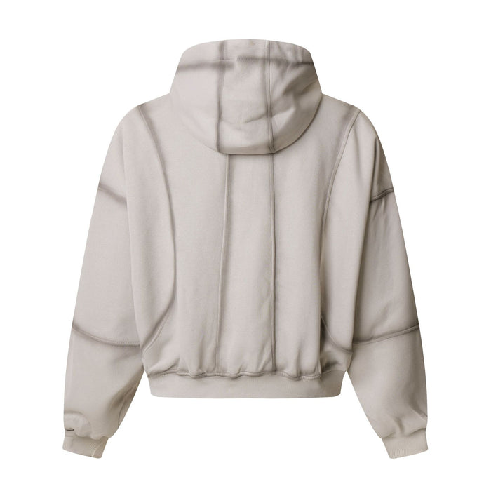 Back view of the light beige zip-up hoodie showing the hood, panelled seams, sleeves and ribbed hem