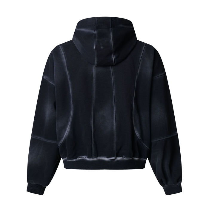 Back view of the black zip-up hoodie showing the hood, vertical panel seams, sleeves and ribbed hem