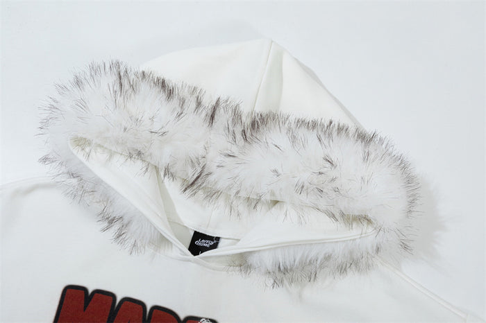 Close-up of the white hoodie hood showing soft faux-fur trim, inner lining, and neck label