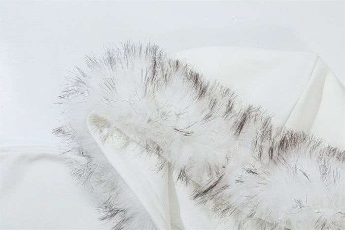 Detailed close-up of white and gray faux-fur trim along the edge of the hoodie hood