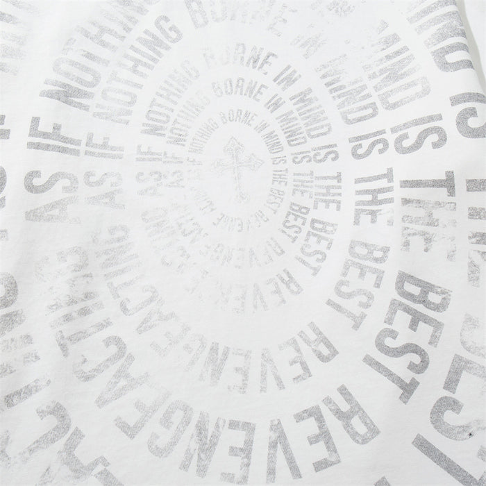 Close-up of the white shirt’s spiral graphic made from layered distressed gray text