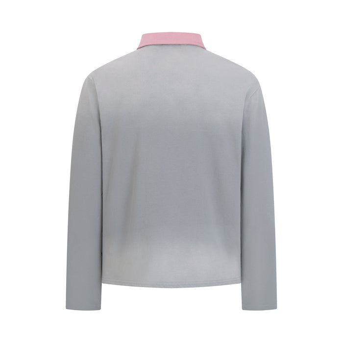 Back view of the gray long sleeve polo shirt with a pink collar and plain fabric