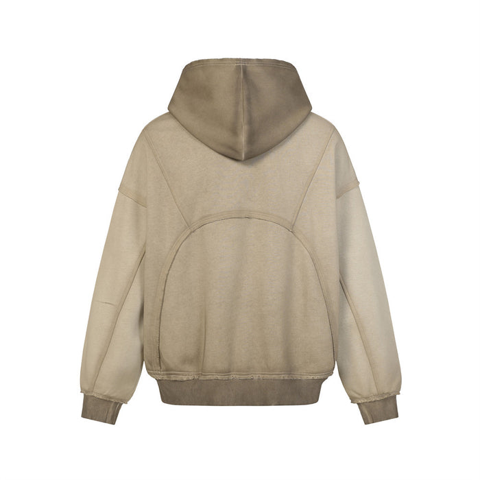 Back view of the beige washed zip-up hoodie with oversized hood, curved seam panels, and ribbed hem