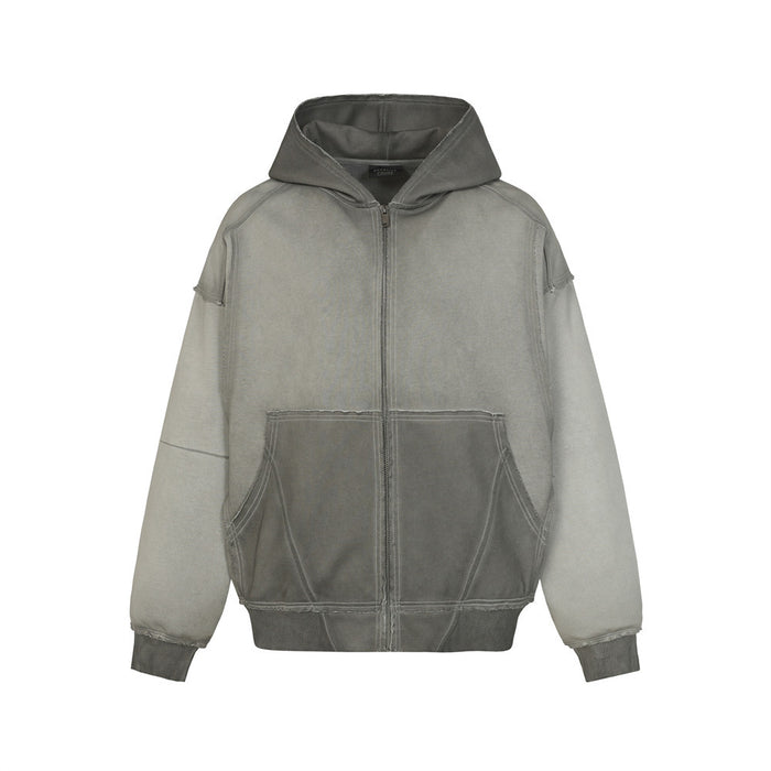Front view of a washed gray oversized zip-up hoodie with hood, kangaroo pockets, and contrast ribbed cuffs