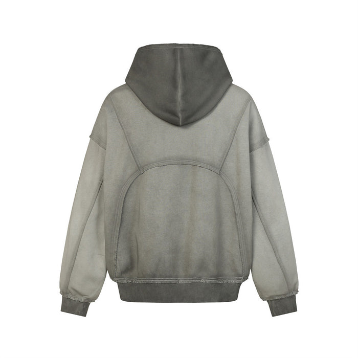 Back view of the washed gray hoodie showing the oversized hood, curved panel seams, and darker ribbed hem