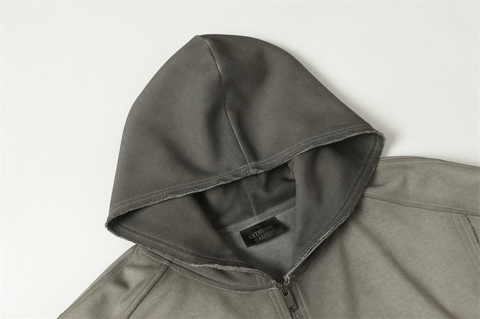 Close-up of the washed gray hoodie showing the hood interior, seam stitching, and front zipper