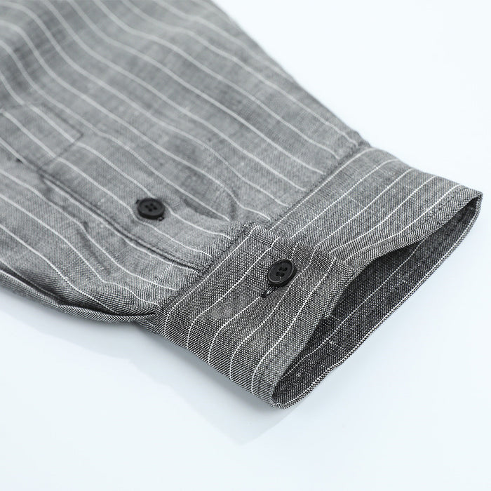 Close-up of the gray pinstripe shirt sleeve cuff with button closure
