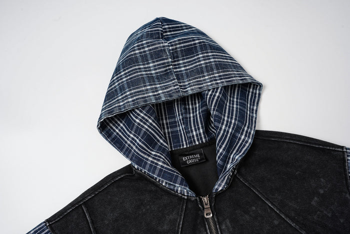 Close-up of the blue plaid hood and black zip-up front panel with visible stitched seams