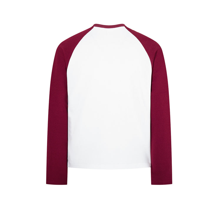 Back view of a white raglan long sleeve tee with burgundy textured sleeves and a plain body