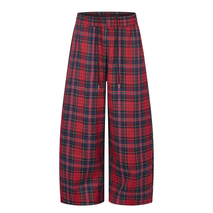 Front view of red plaid wide-leg pants with an elastic waistband and relaxed straight legs