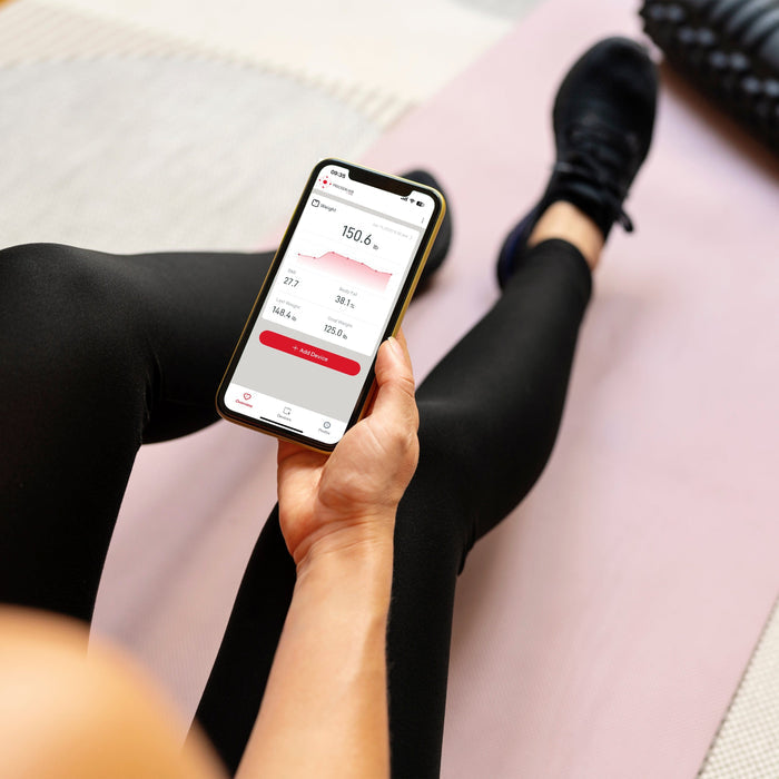 Smartphone screen shows the Precision Hub weight tracking app with weight 150.6 lb and a chart