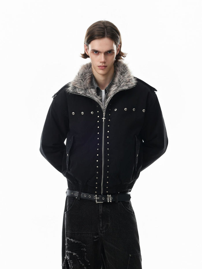 Model wearing a black bomber jacket with gray faux fur collar and rows of metal studs