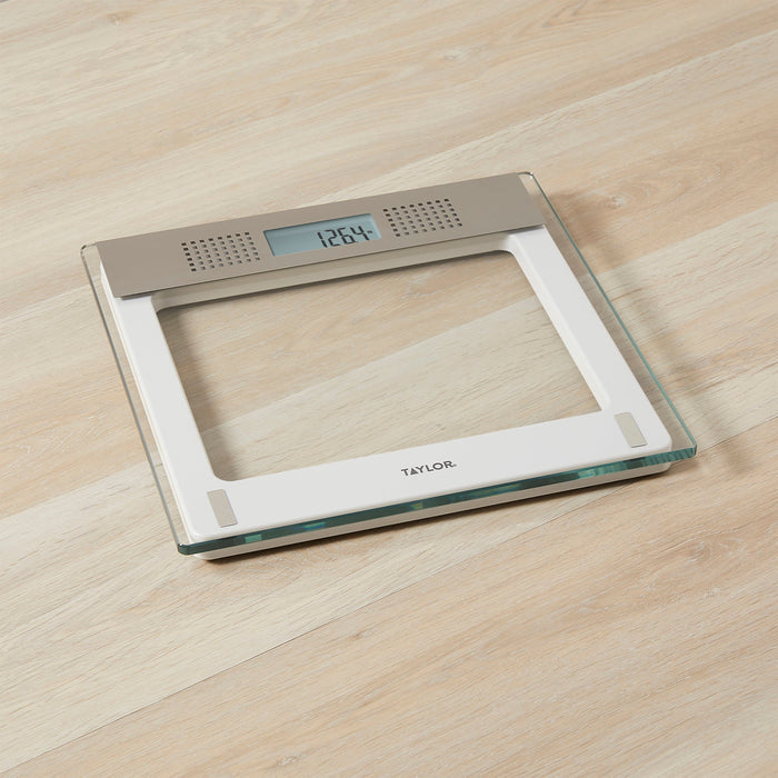 Top view of Taylor digital bathroom scale with taupe metal panel on glass platform and display reading 126.4 lb